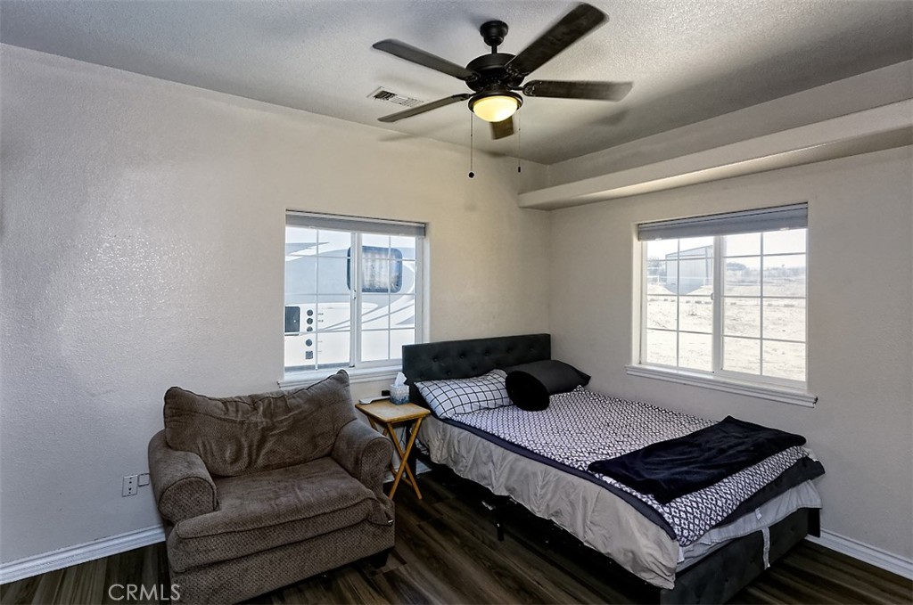 8855 Smith Road Phelan, CA 92371 - Photo 25 of 43 a bedroom with a bed and window