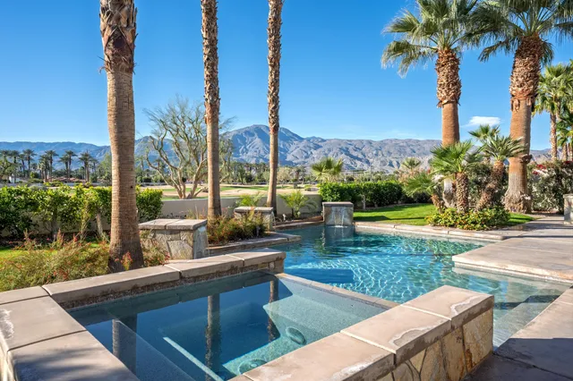 a view of a patio with table and chairs and potted plants