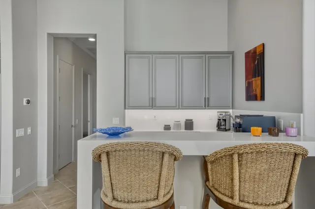 a dining room with furniture and front door