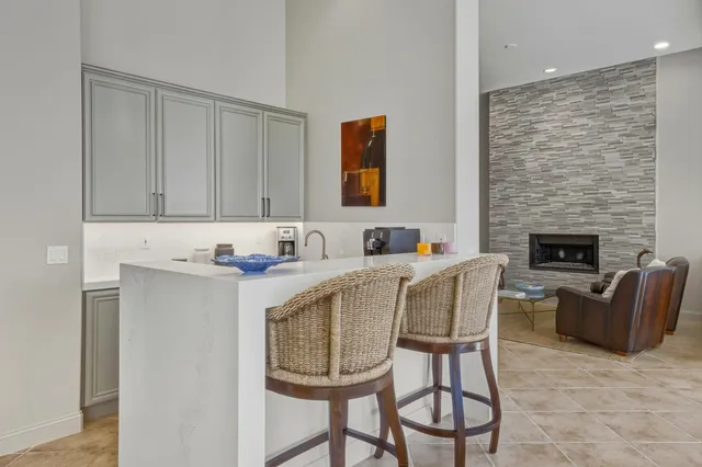 a large bathroom with a double vanity sink a mirror and a shower