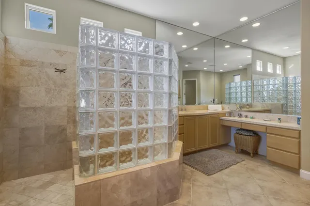 a living room with furniture cabinets and window