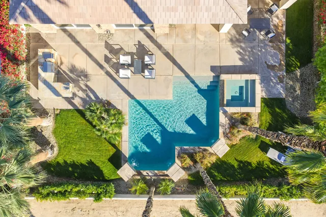a view of a patio with a table and chairs