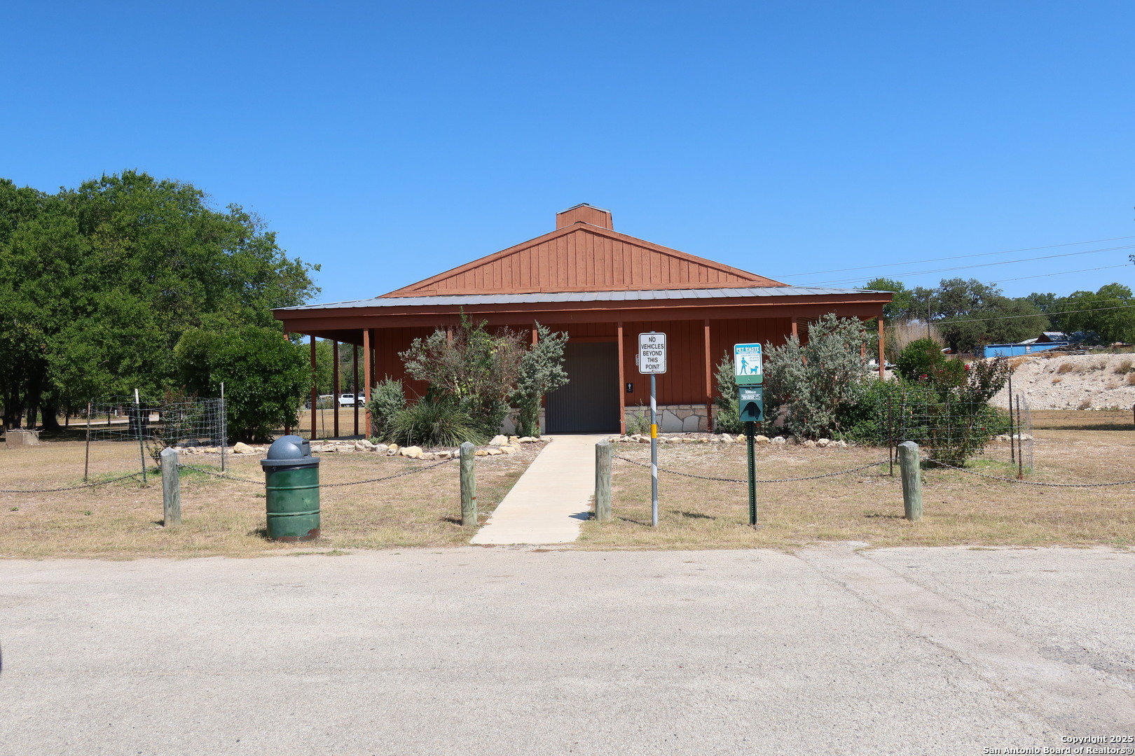 Tbd Lot 1 Pecan Bandera, TX 78003 - Photo 12 of 17 a patio with a table and chairs under an umbrella