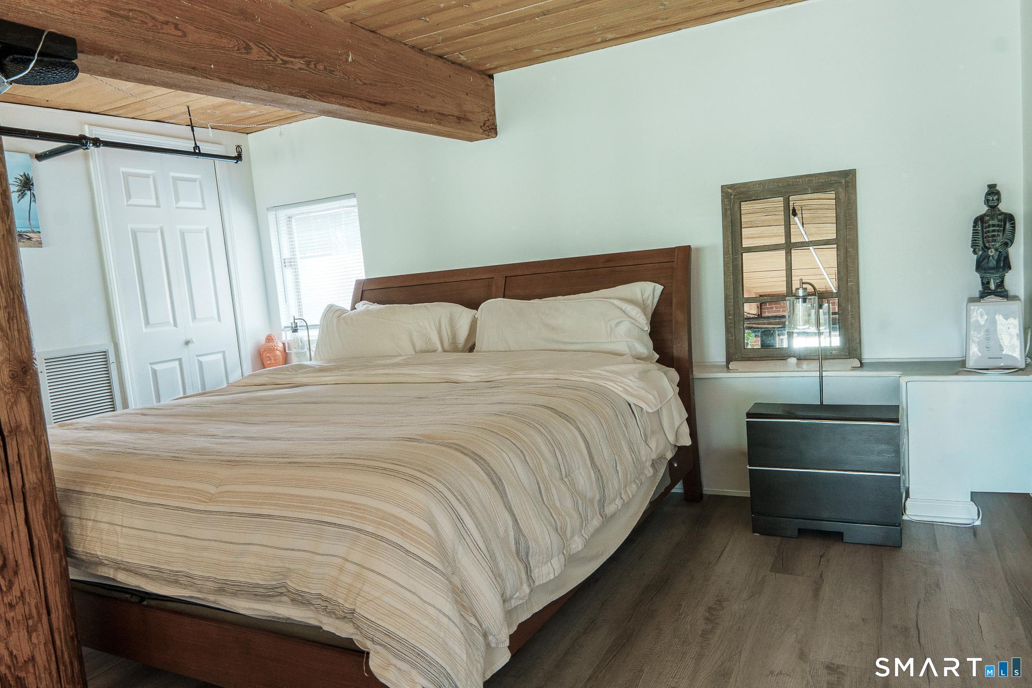 839 Main Street, Unit 68 Torrington, CT 06790 - Photo 6 of 20 a bedroom with a bed and window
