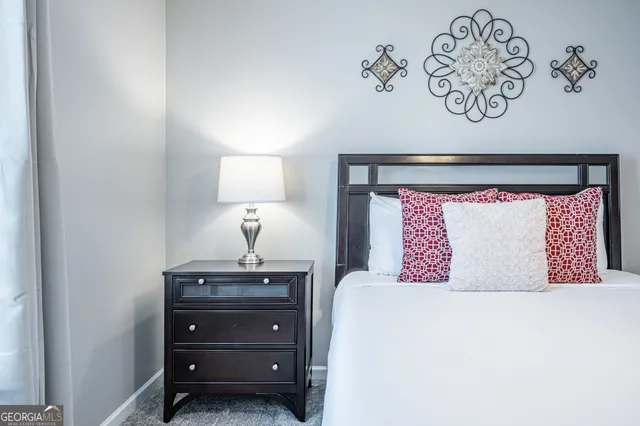 a bedroom with a bed and a table in it