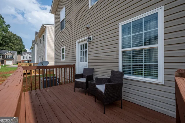 a view of a deck with furniture