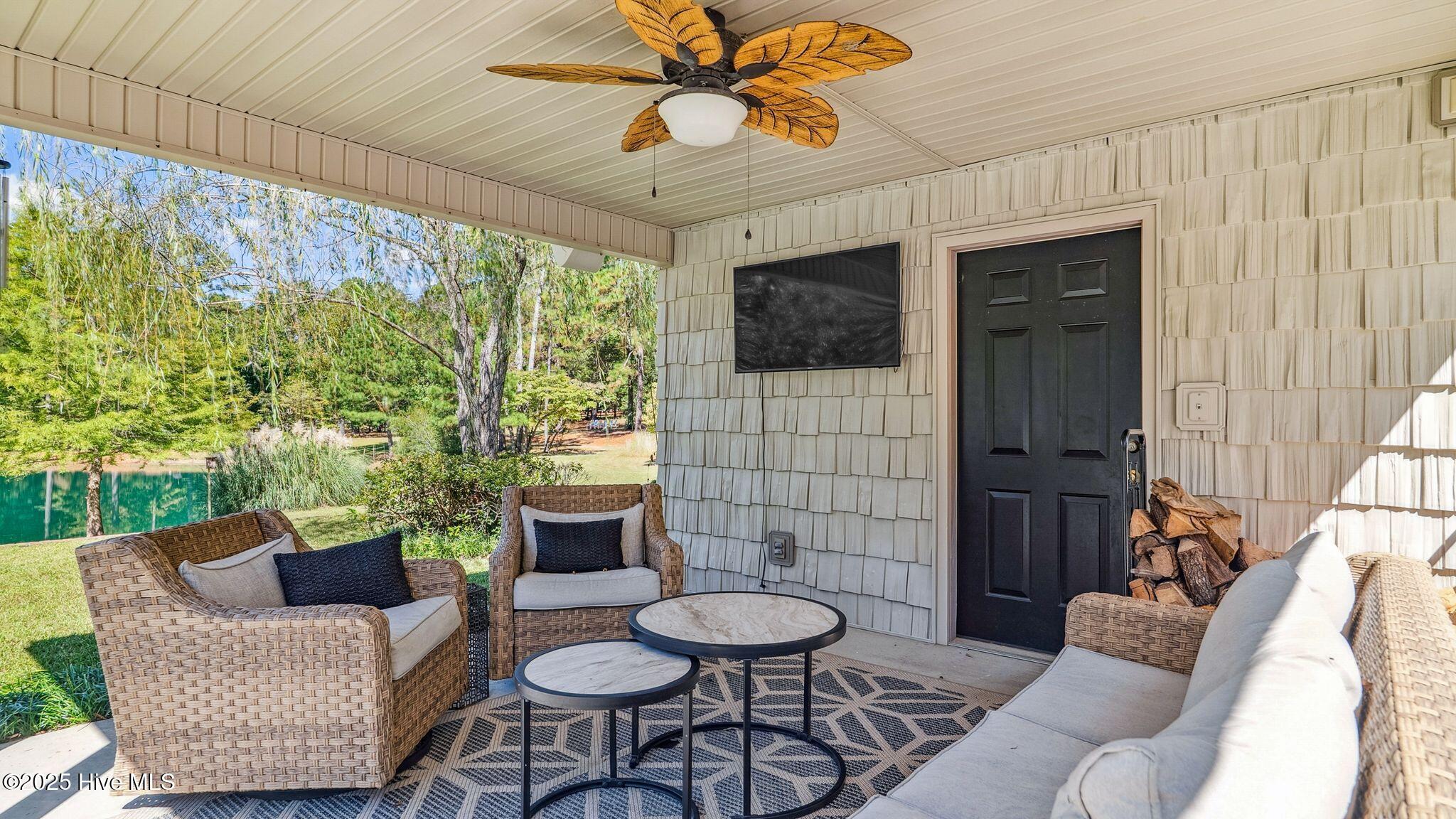 1336 McCaskill Road Carthage, NC 28327 - Photo 61 of 88 Poolside cabana offers shaded seating, utility storage room & outdoor entertainment system
