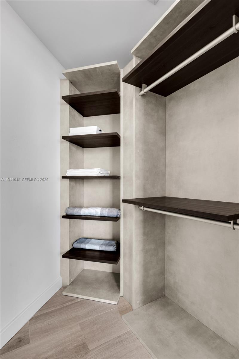 45 Southwest 9th Street, Unit 1001 Miami, FL 33130 - Photo 22 of 40 a view of walk in closet with empty racks