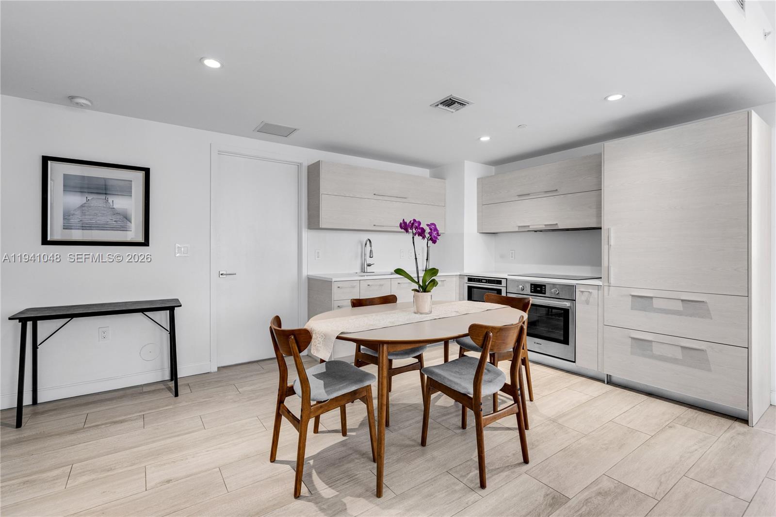 45 Southwest 9th Street, Unit 1001 Miami, FL 33130 - Photo 9 of 40 a view of a dining room with furniture