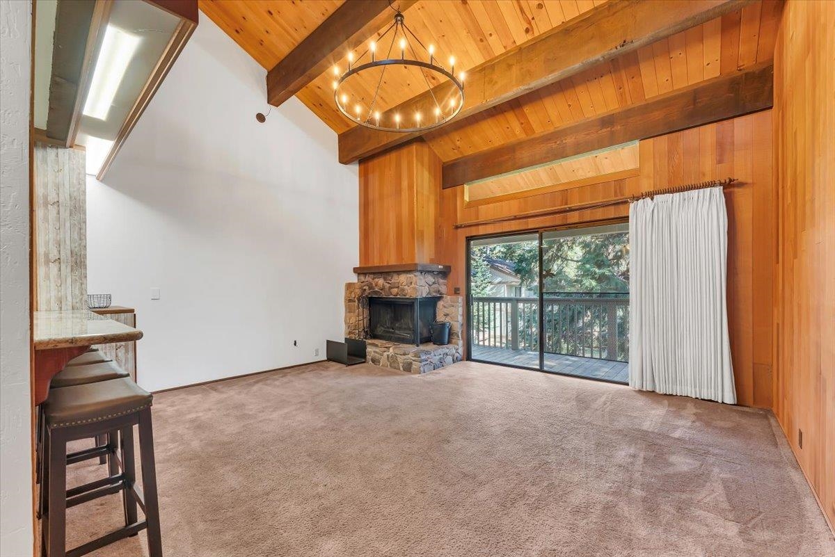 1001 Commonwealth Drive, Unit 49 Kings Beach, CA 96143 - Photo 12 of 25 a view of an empty room with a fireplace and a window