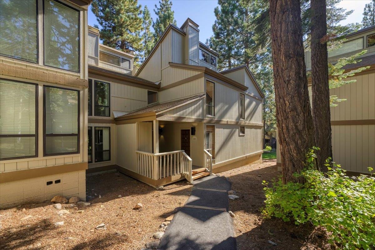 1001 Commonwealth Drive, Unit 49 Kings Beach, CA 96143 - Photo 2 of 25 a house with trees in front of it