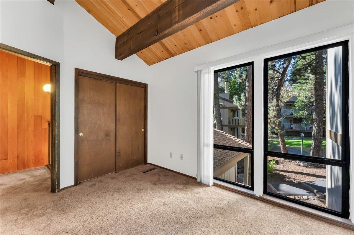 1001 Commonwealth Drive, Unit 49 Kings Beach, CA 96143 - Photo 21 of 25 an empty room with floor to ceiling windows and floor to ceiling window