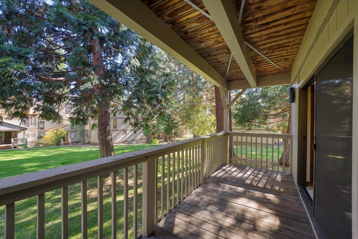 1001 Commonwealth Drive, Unit 49 Kings Beach, CA 96143 - Photo 8 of 25 a view of a wooden deck next to a yard
