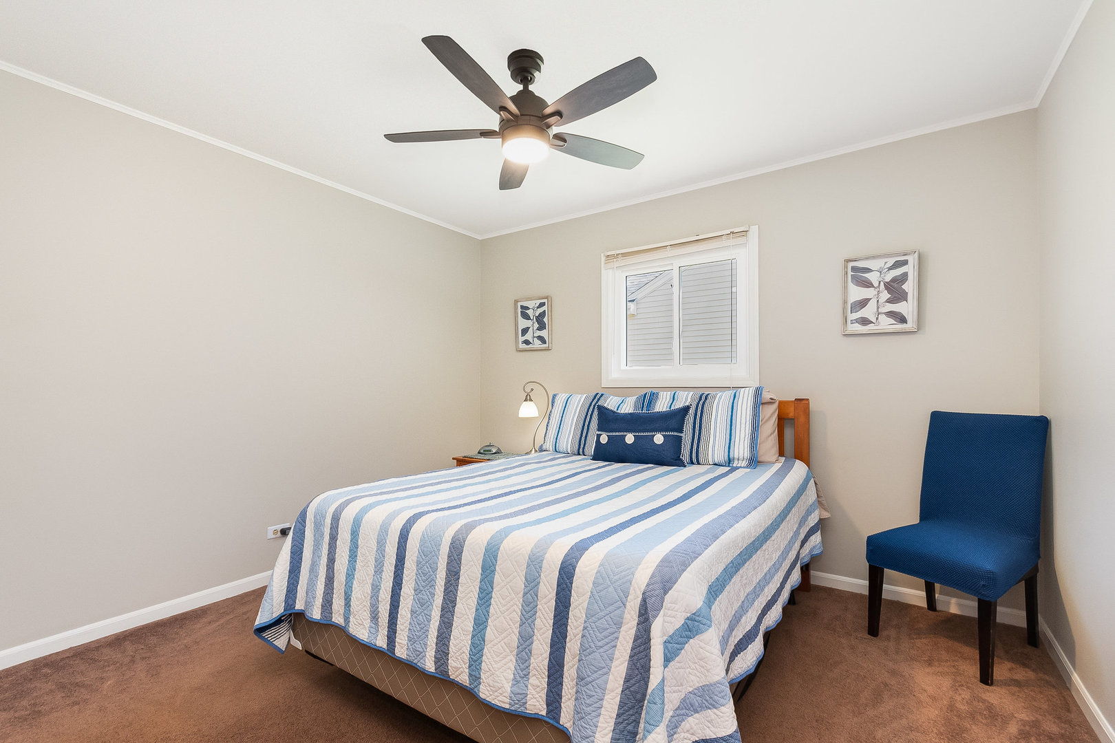 2245 Lakeside Drive Aurora, IL 60504 - Photo 12 of 32 a bedroom with a bed a chair and a large window