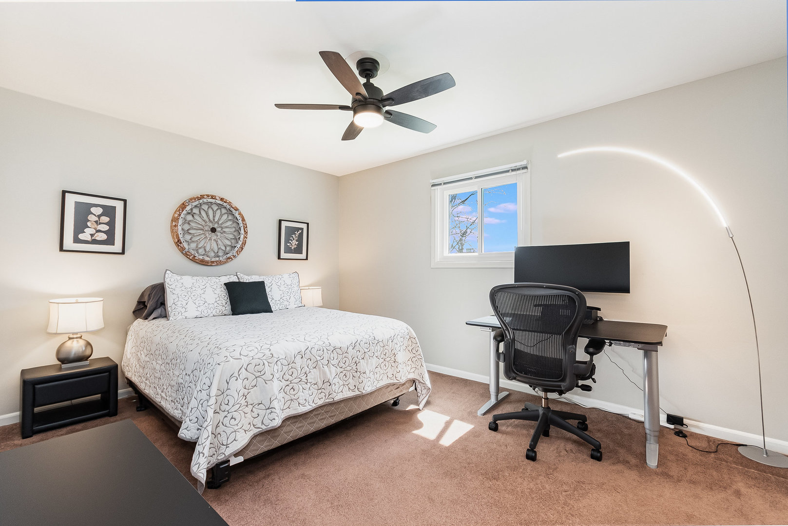 2245 Lakeside Drive Aurora, IL 60504 - Photo 13 of 32 a bedroom with a bed a clock on the wall and a large window