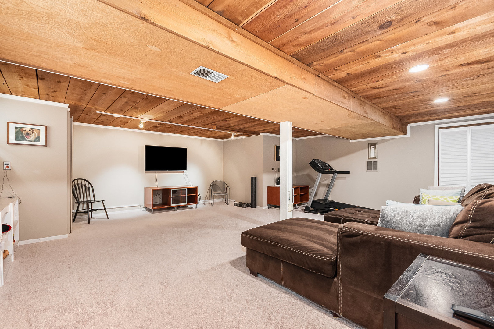 2245 Lakeside Drive Aurora, IL 60504 - Photo 17 of 32 a living room with furniture and a flat screen tv