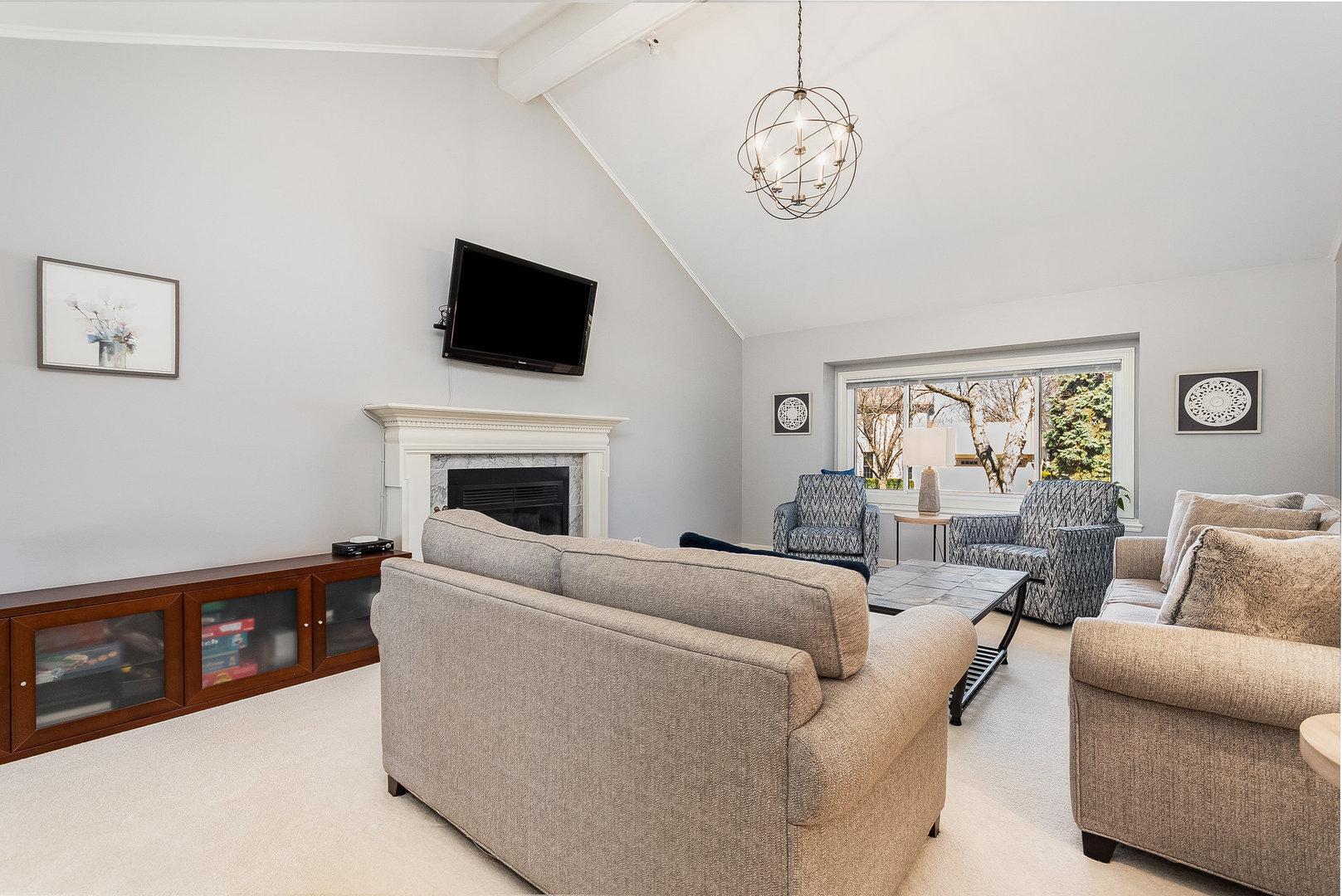 2245 Lakeside Drive Aurora, IL 60504 - Photo 4 of 32 a living room with furniture a flat screen tv and a fireplace