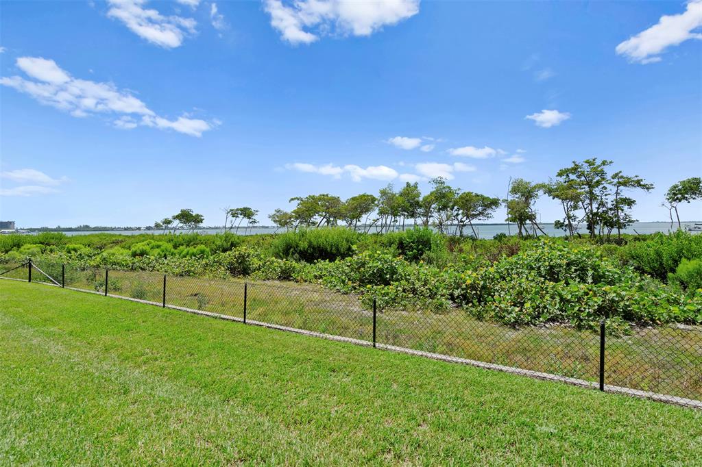 23 Harbour Isle Drive West, Unit 102 Fort Pierce, FL 34949 - Photo 27 of 40 a view of a garden with a building