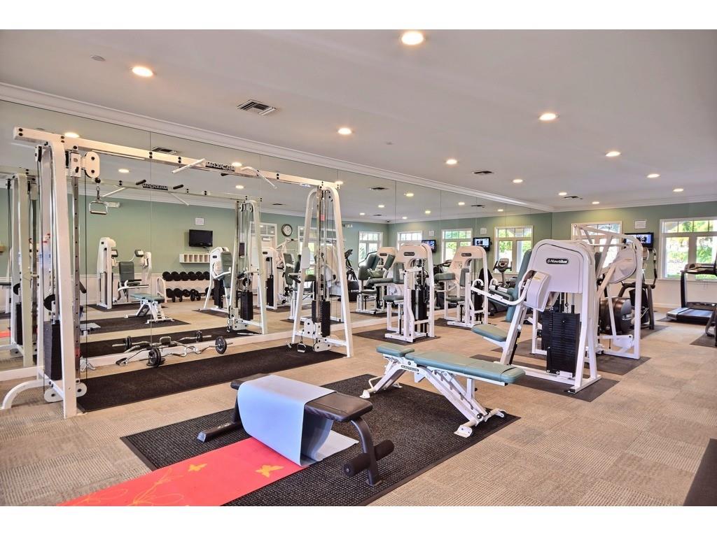 23 Harbour Isle Drive West, Unit 102 Fort Pierce, FL 34949 - Photo 33 of 40 a room with lots of gym equipment
