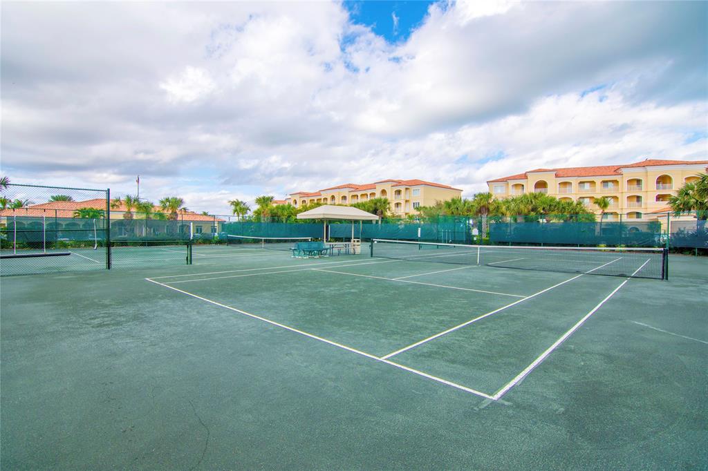 23 Harbour Isle Drive West, Unit 102 Fort Pierce, FL 34949 - Photo 34 of 40 a view of a tennis court