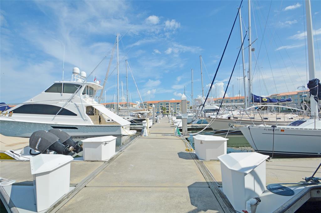 23 Harbour Isle Drive West, Unit 102 Fort Pierce, FL 34949 - Photo 36 of 40 a view of a kitchen with a sink and a stove