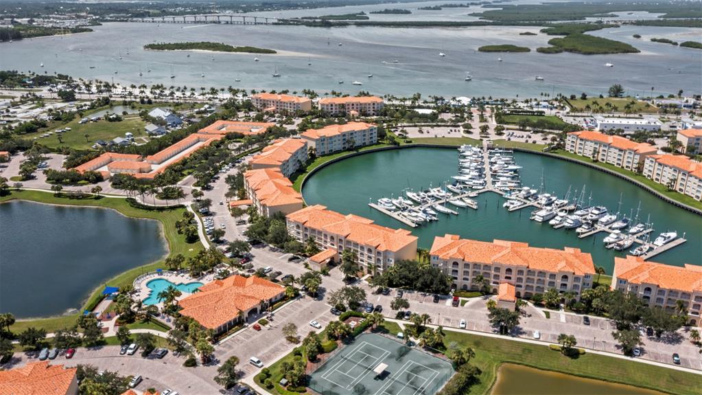23 Harbour Isle Drive West, Unit 102 Fort Pierce, FL 34949 - Photo 37 of 40 an aerial view of residential houses with outdoor space
