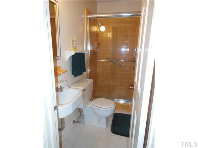 1115 Briardale Road Durham, NC 27712 - Photo 10 of 25 The shower looks brand new and gives the term spic and span new meaning! The newer frameless glass shower doors are very convenient. Bathroom