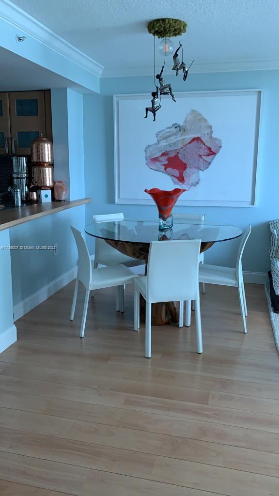 2101 Brickell Avenue, Unit 1709 Miami, FL 33129 - Photo 13 of 14 a room with furniture and a table