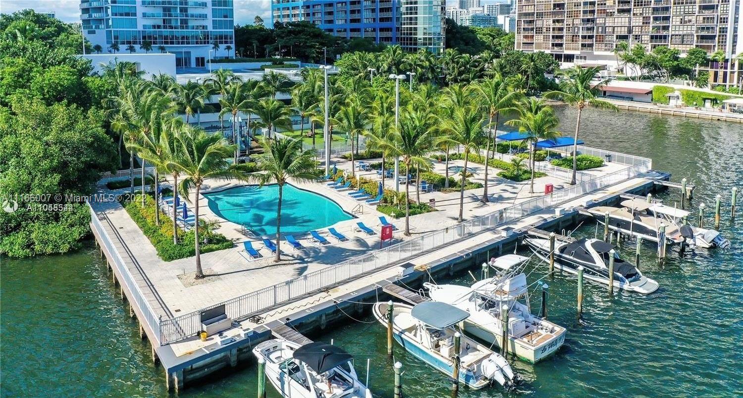 2101 Brickell Avenue, Unit 1709 Miami, FL 33129 - Photo 4 of 14 a view of a chairs and table in a patio