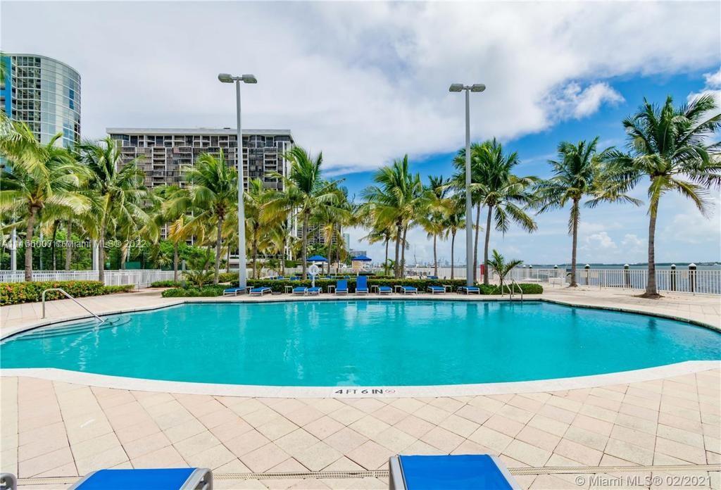 2101 Brickell Avenue, Unit 1709 Miami, FL 33129 - Photo 5 of 14 a view of a swimming pool and a chair