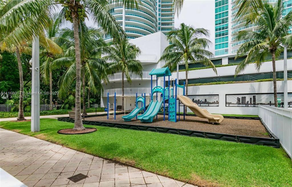 2101 Brickell Avenue, Unit 1709 Miami, FL 33129 - Photo 6 of 14 a view of a park with swings and slides