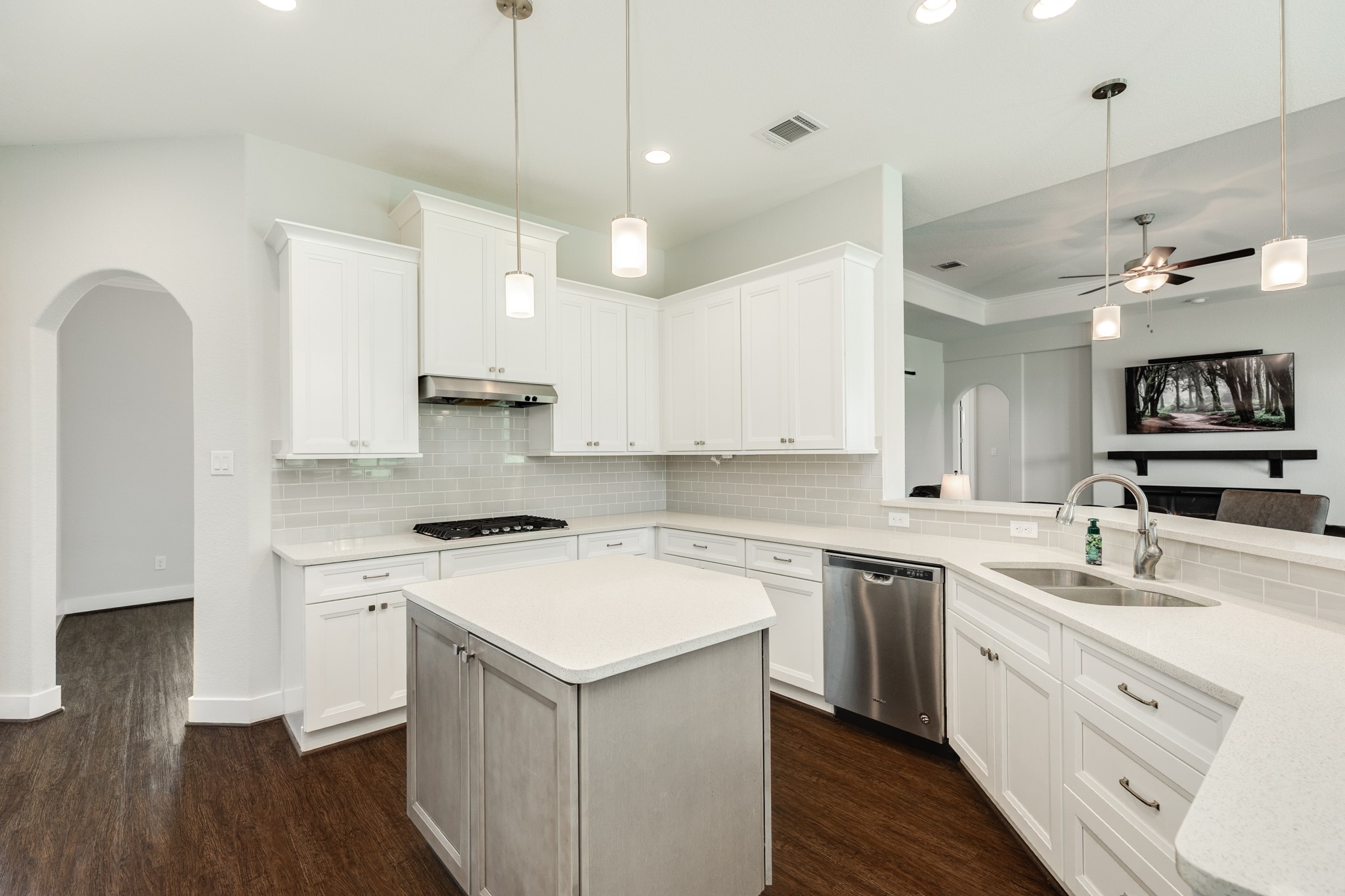 527 Lakeland Circle Rosharon, TX 77583 - Photo 22 of 42 a kitchen with a sink a stove a refrigerator and white cabinets