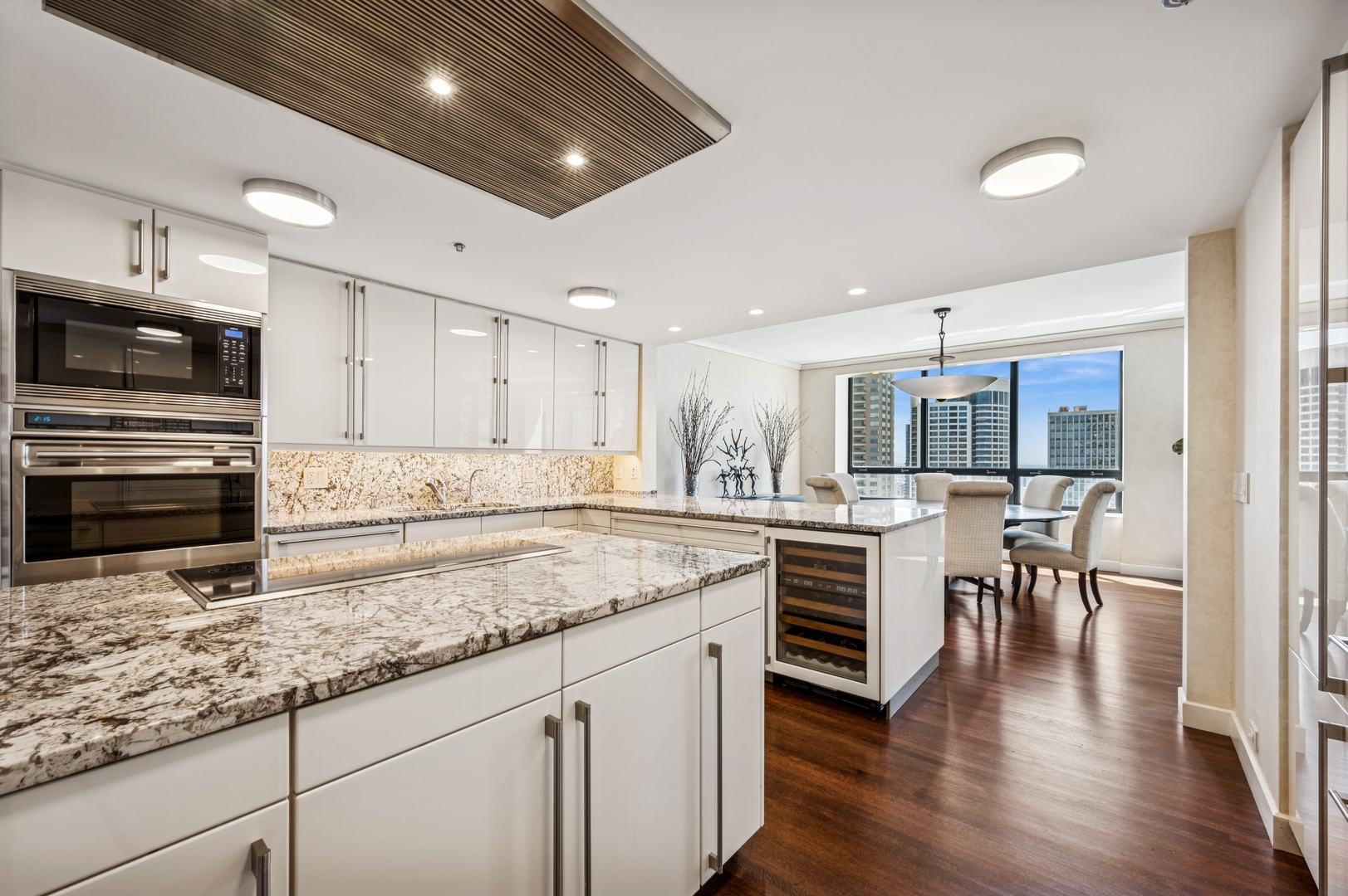 180 East Pearson Street, Unit 3701 Chicago, IL 60611 - Photo 12 of 36 a kitchen with a stove a sink and a microwave