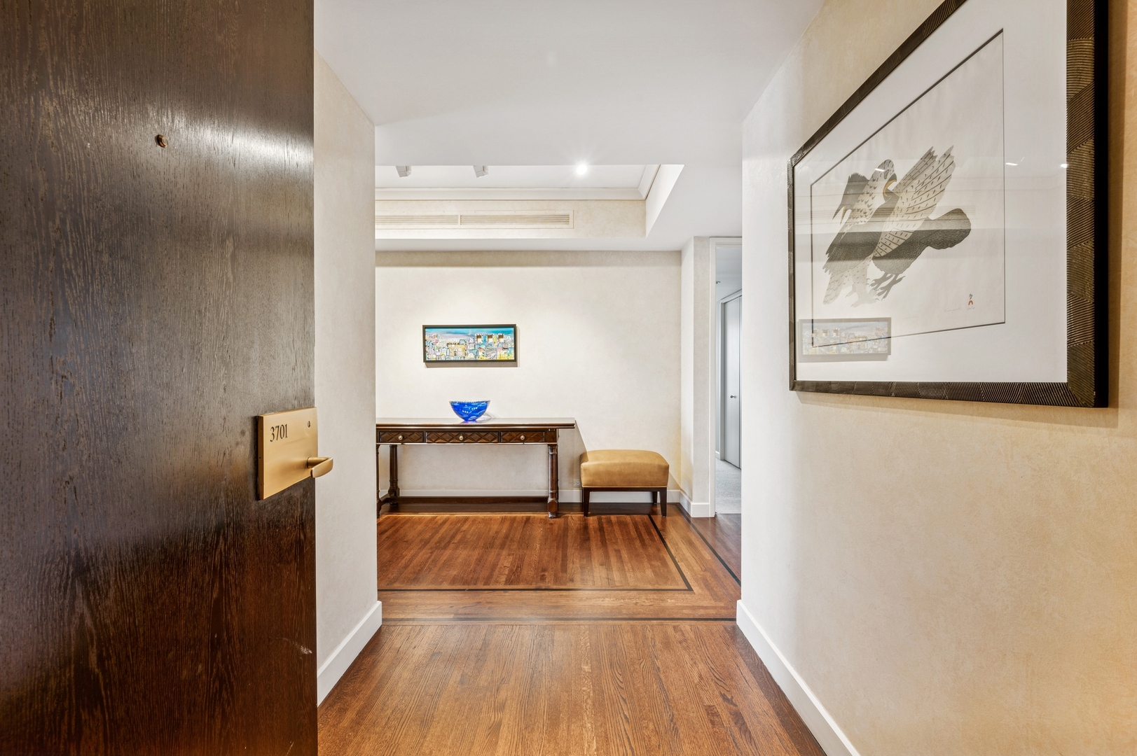180 East Pearson Street, Unit 3701 Chicago, IL 60611 - Photo 4 of 36 a view of dining room with furniture and wooden floor
