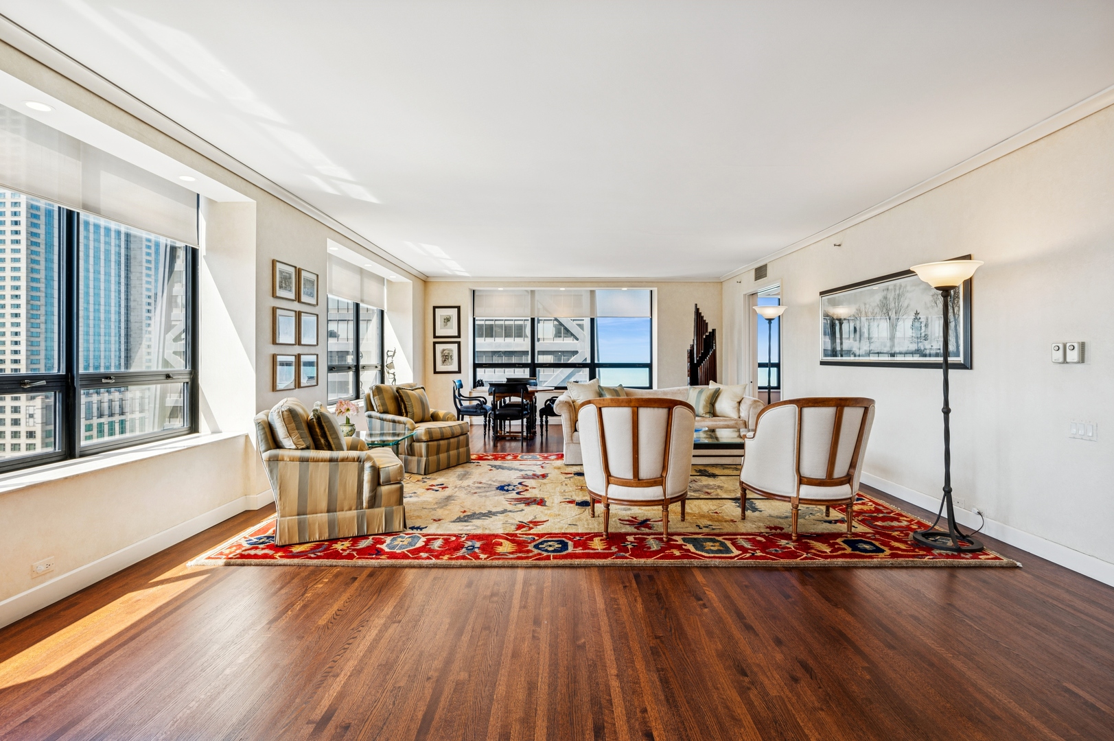 180 East Pearson Street, Unit 3701 Chicago, IL 60611 - Photo 6 of 36 a living room with furniture floor to ceiling window and wooden floor