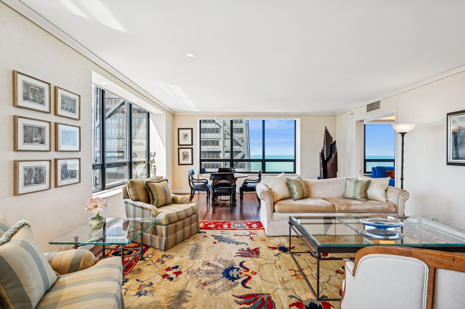 180 East Pearson Street, Unit 3701 Chicago, IL 60611 - Photo 7 of 36 a living room with furniture and floor to ceiling windows