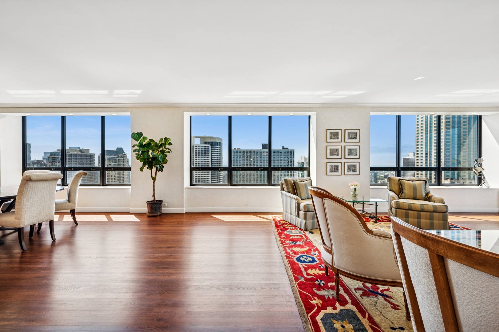 180 East Pearson Street, Unit 3701 Chicago, IL 60611 - Photo 9 of 36 a living room with furniture and a large window