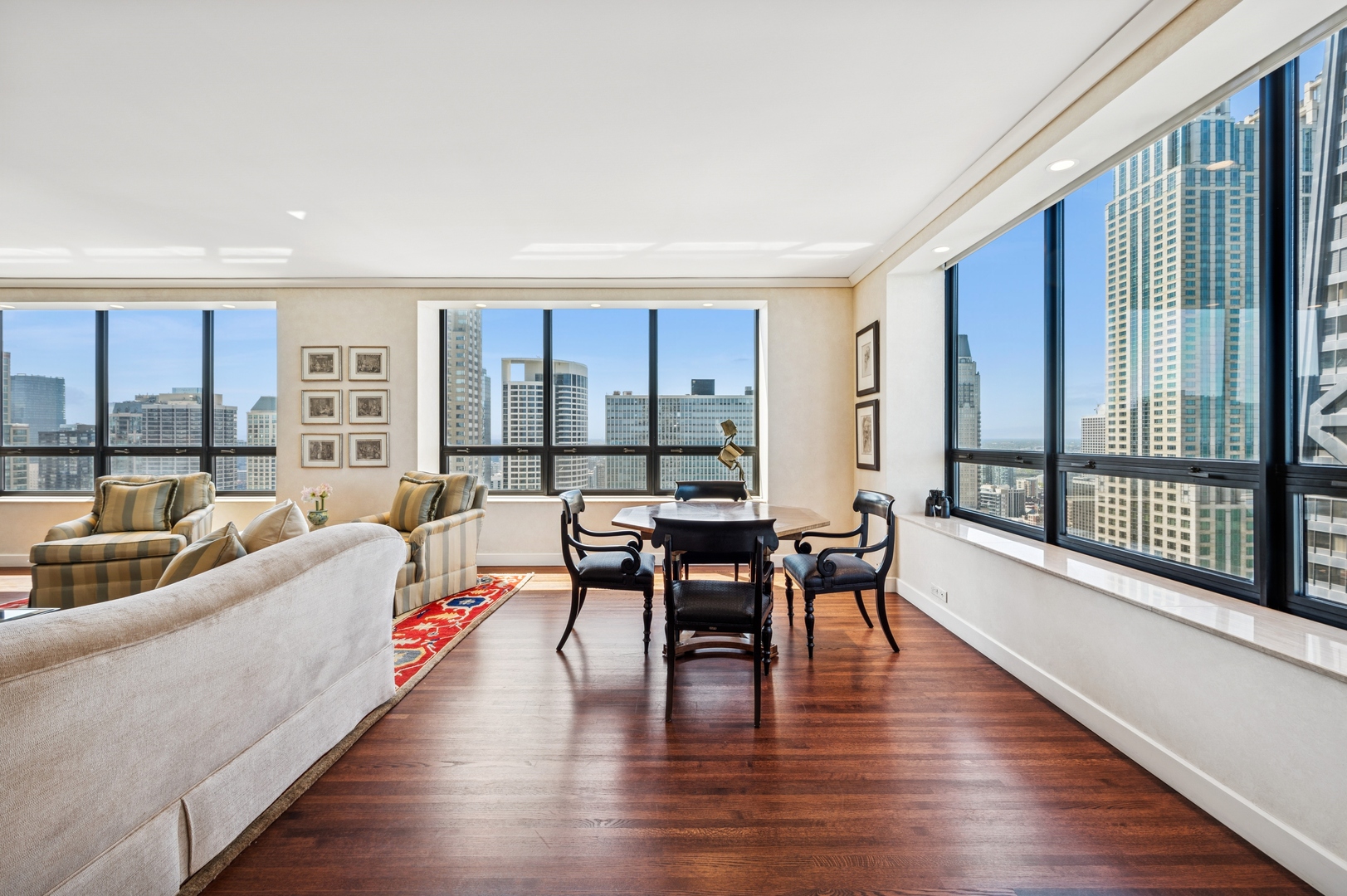 180 East Pearson Street, Unit 3701 Chicago, IL 60611 - Photo 10 of 36 a living room with furniture and a large window