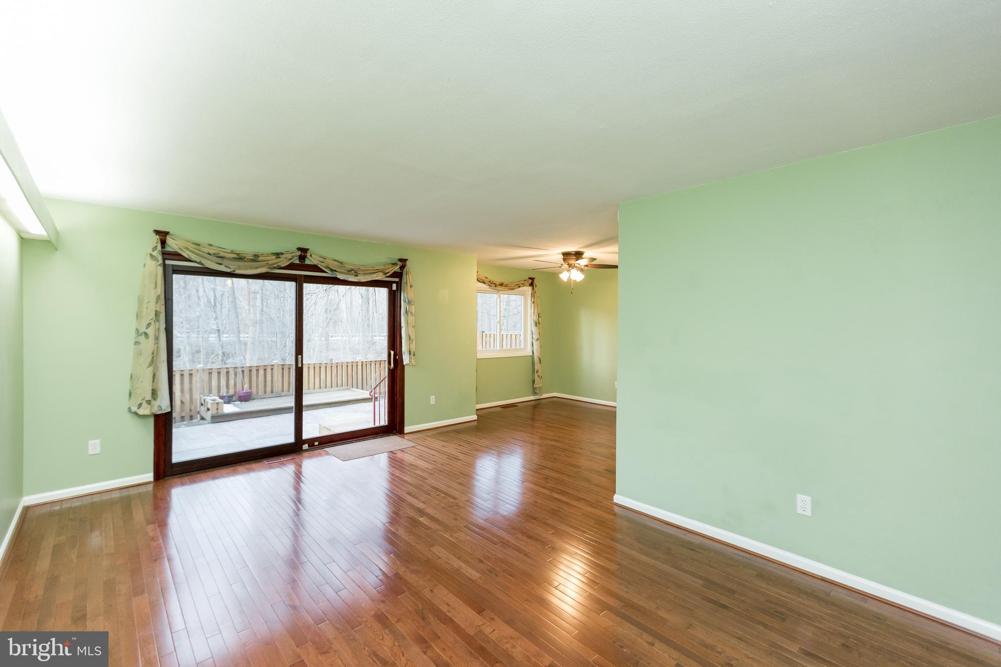5806 Canvasback Road Burke, VA 22015 - Photo 6 of 43 Living room opens to patio