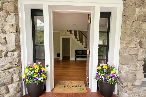 a bunch of flowers in front of a door