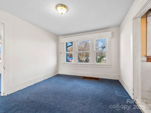 a spacious bathroom with a sink a large mirror and a bathtub