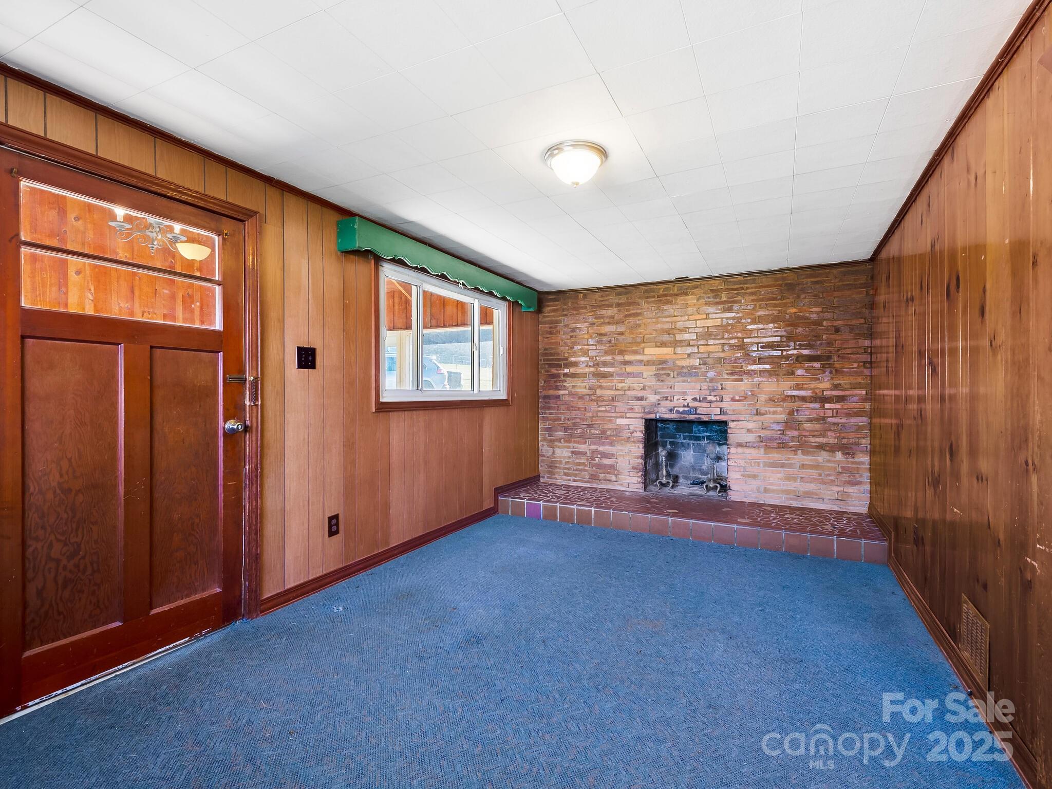 71 Lower Glady Fork Road Candler, NC 28715 - Photo 16 of 43 an empty room with windows