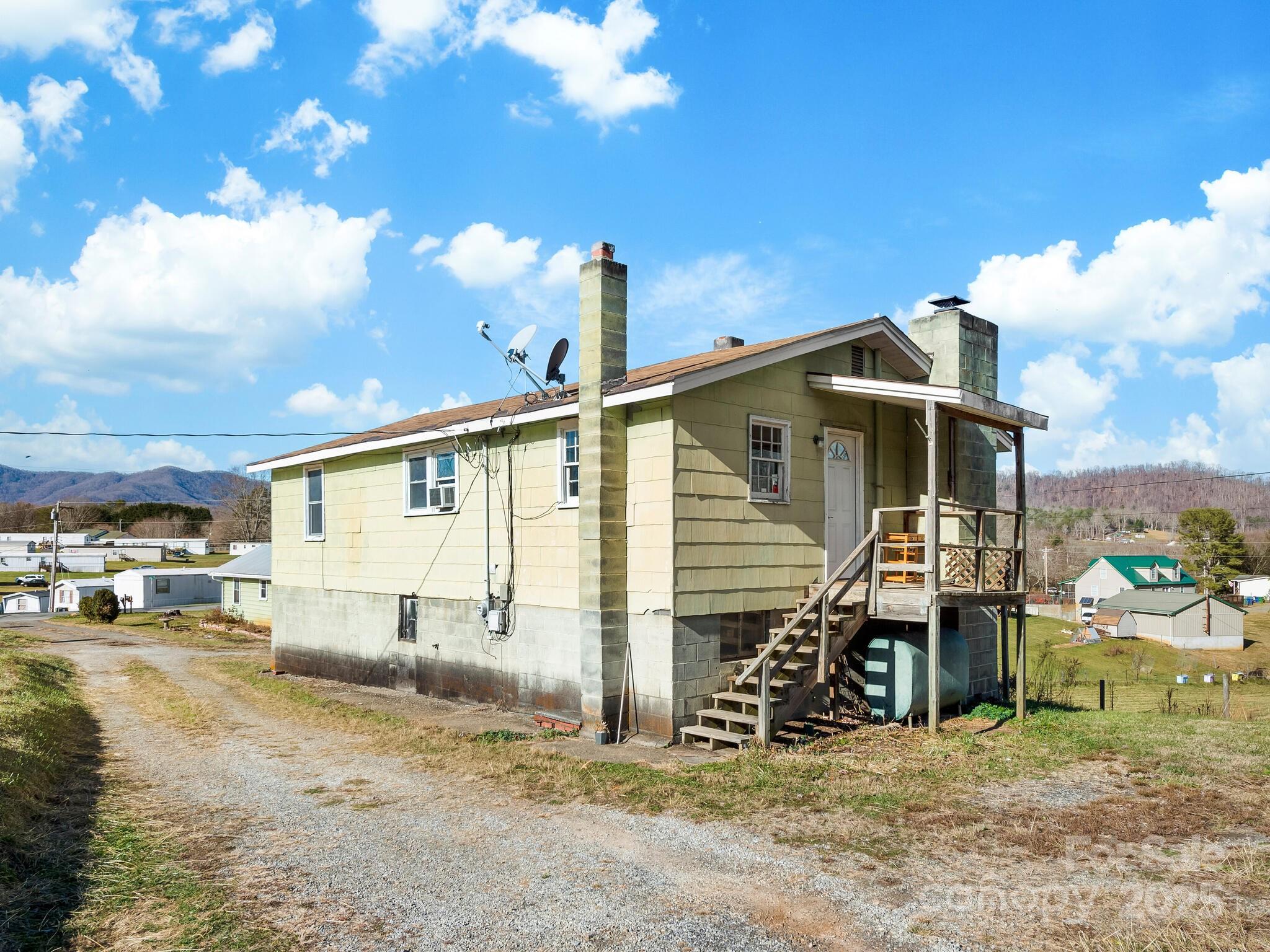 71 Lower Glady Fork Road Candler, NC 28715 - Photo 27 of 43 a front view of a house with a yard