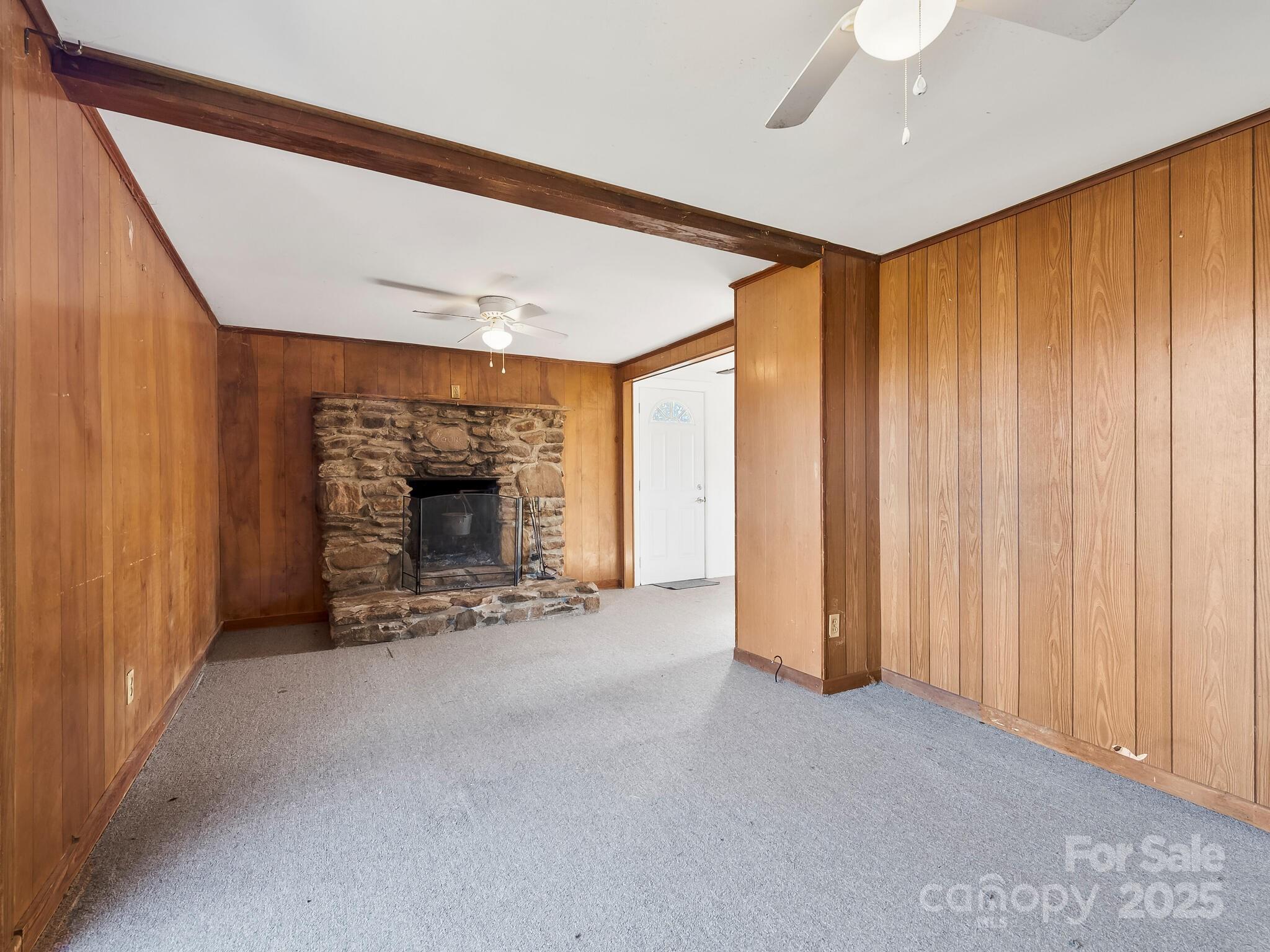 71 Lower Glady Fork Road Candler, NC 28715 - Photo 32 of 43 a view of an empty room with a fireplace