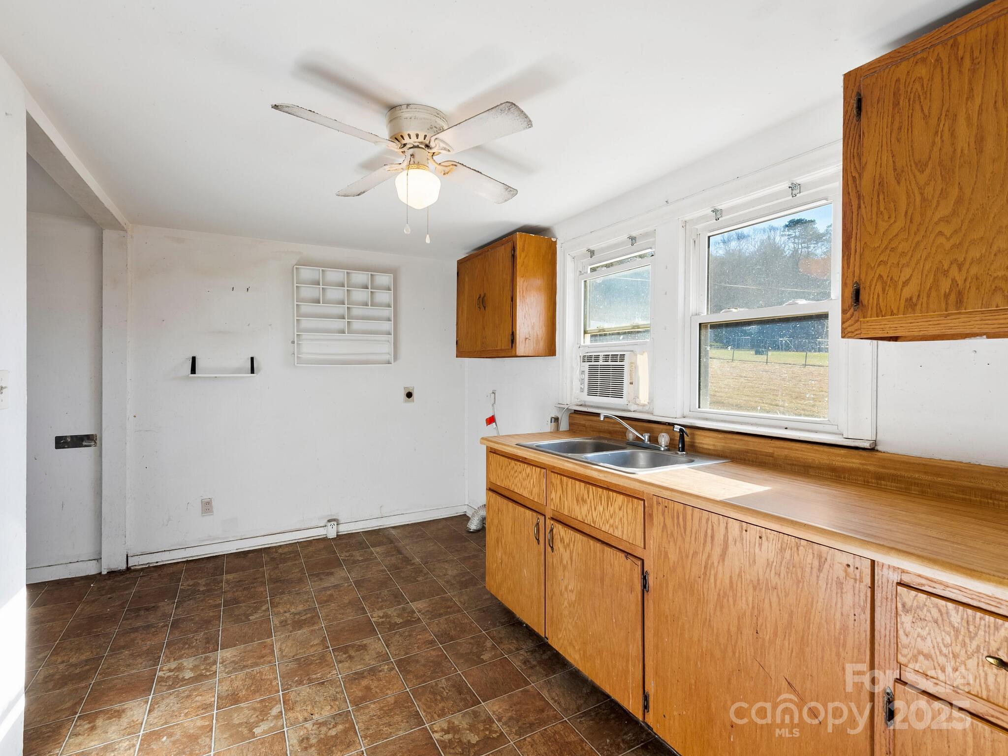 71 Lower Glady Fork Road Candler, NC 28715 - Photo 34 of 43 a view of a kitchen with stainless steel appliances granite countertop a sink and a stove next to a window