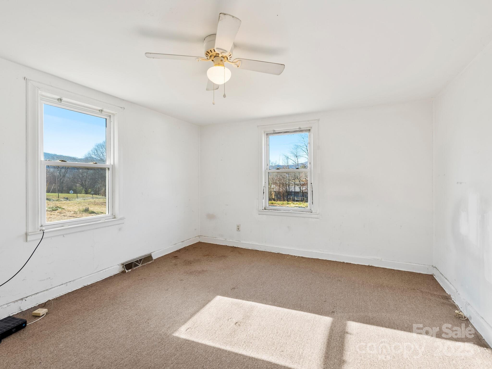71 Lower Glady Fork Road Candler, NC 28715 - Photo 35 of 43 an empty room with a window