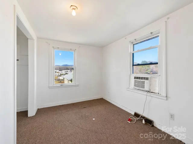 a view of a terrace with wooden floor and a mountain view
