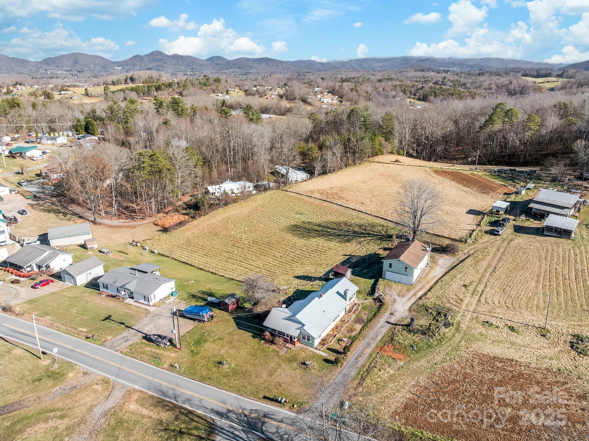 71 Lower Glady Fork Road Candler, NC 28715 - Photo 39 of 43 a view of a terrace with wooden floor and a mountain view