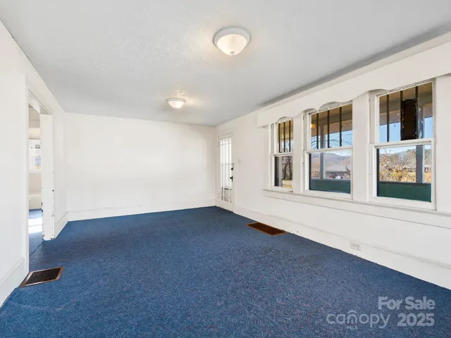 an empty room with windows