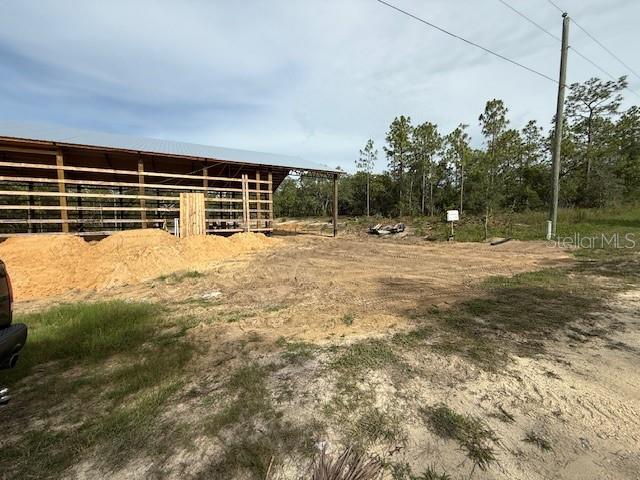 16386 Kakawi Road Weeki Wachee, FL 34614 - Photo 8 of 14 a backyard of a house